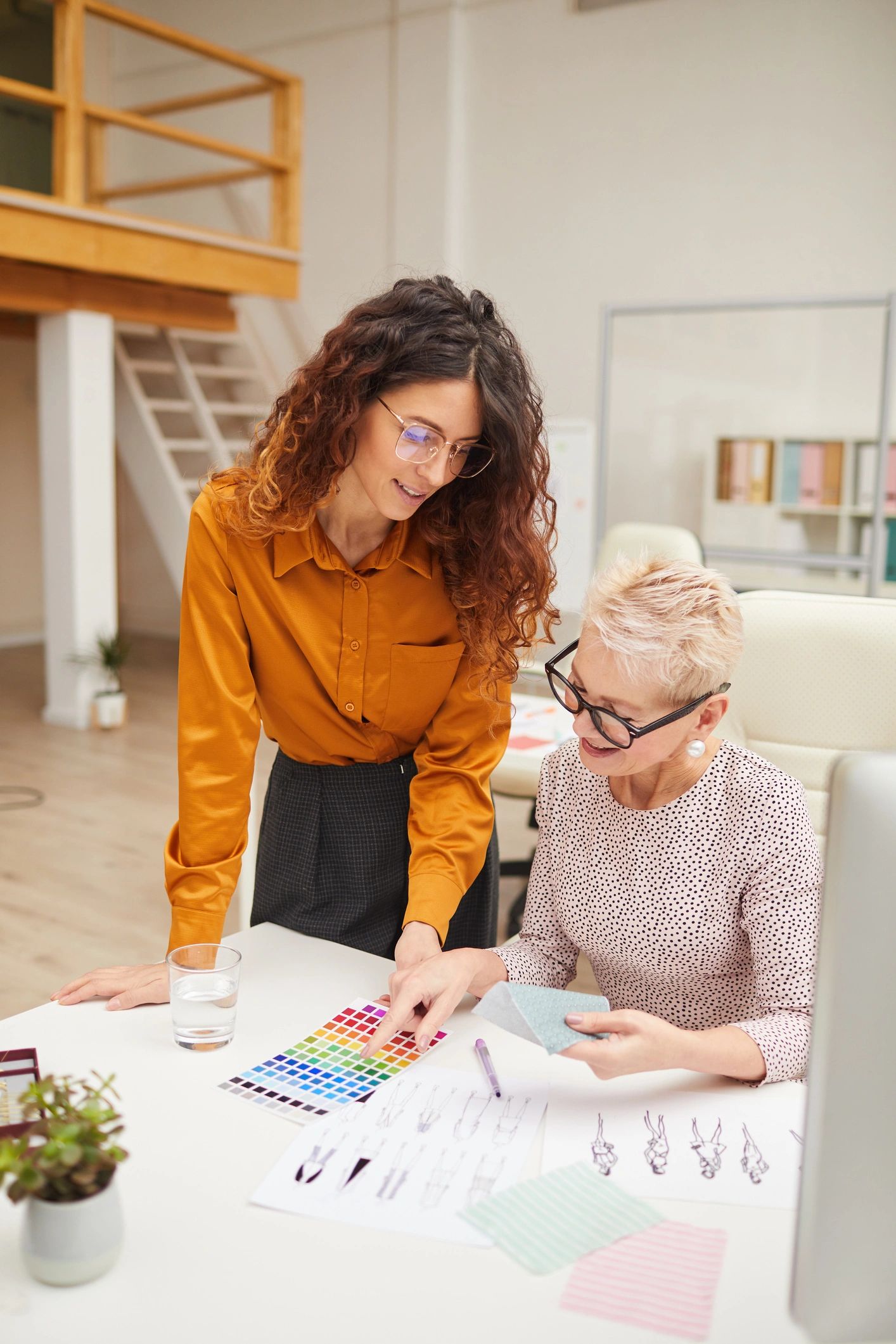 Portrait of a fashion team member reviewing clothing colors
